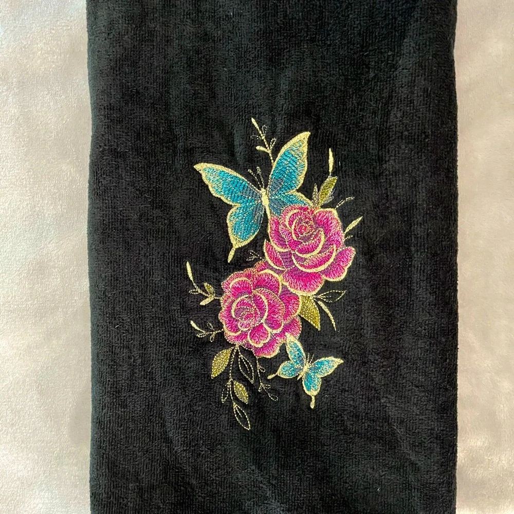 Handcrafted floral hummingbird/butterfly theme embroidered pair of hand towels.